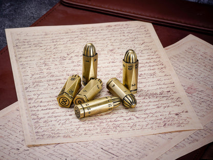 Six bronze metal bullet dice