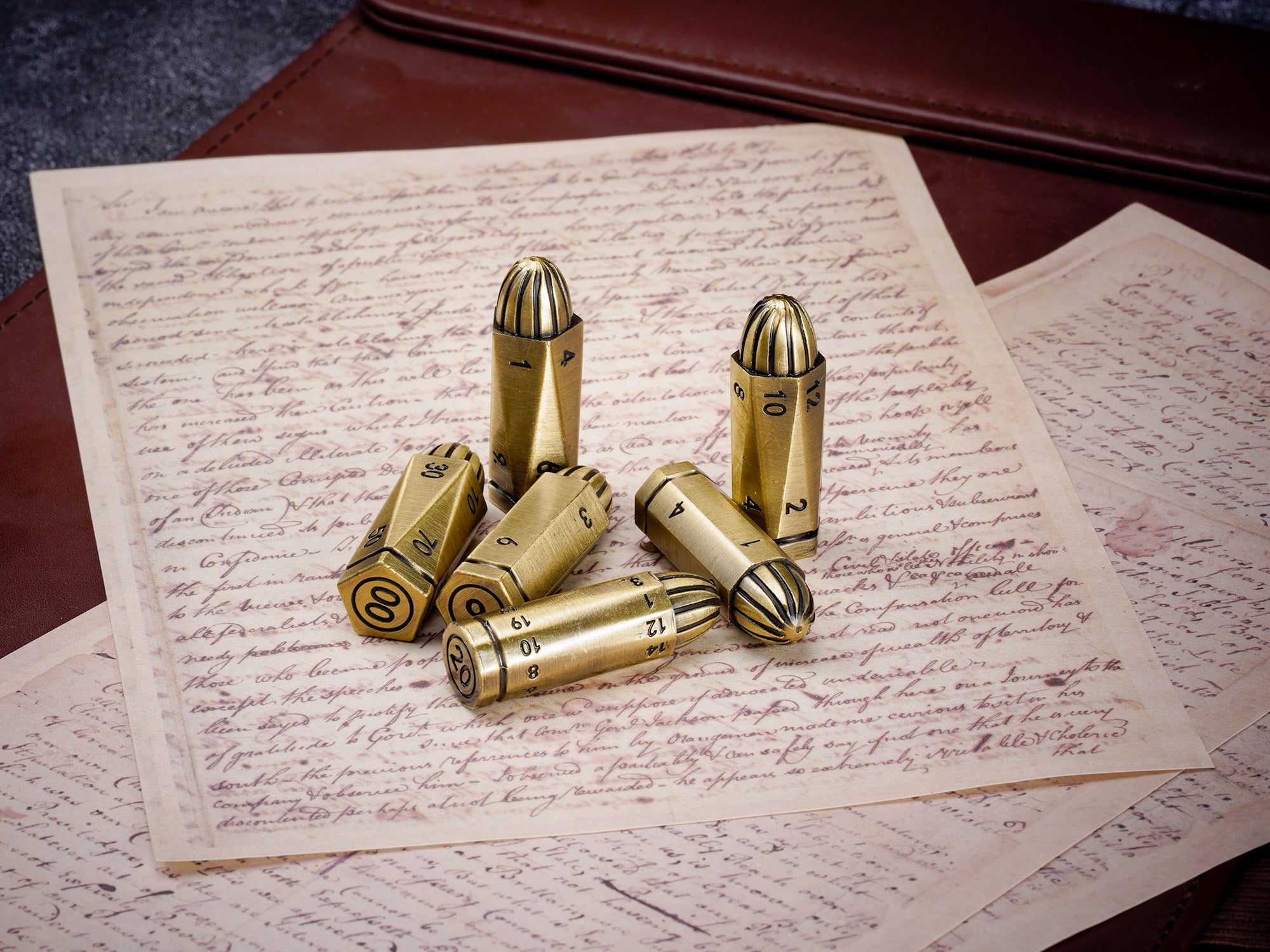 Six bronze metal bullet dice